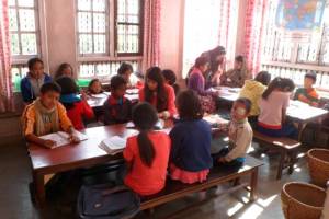 Tuition time for the youngest children; Pratikshya is in the middle and Sarita to the end. 